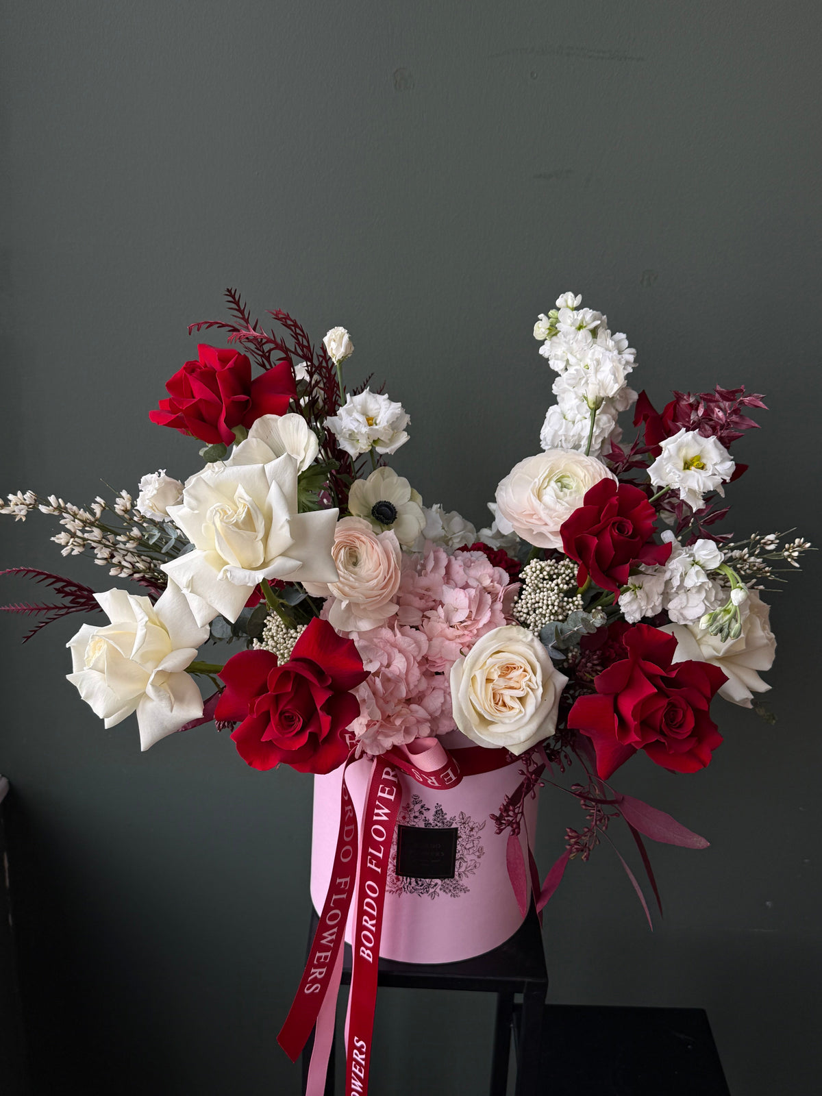 “XOXO” white, pink, and red floral box arrangement