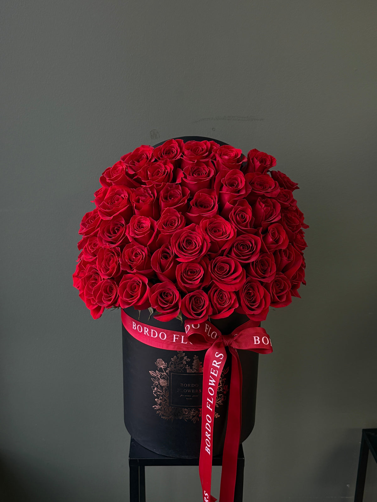 "50 Reasons Why" arrangement: 50 premium roses in a refined box design with a front-facing display. Includes wet floral sponge. Delivery in Dallas TX.