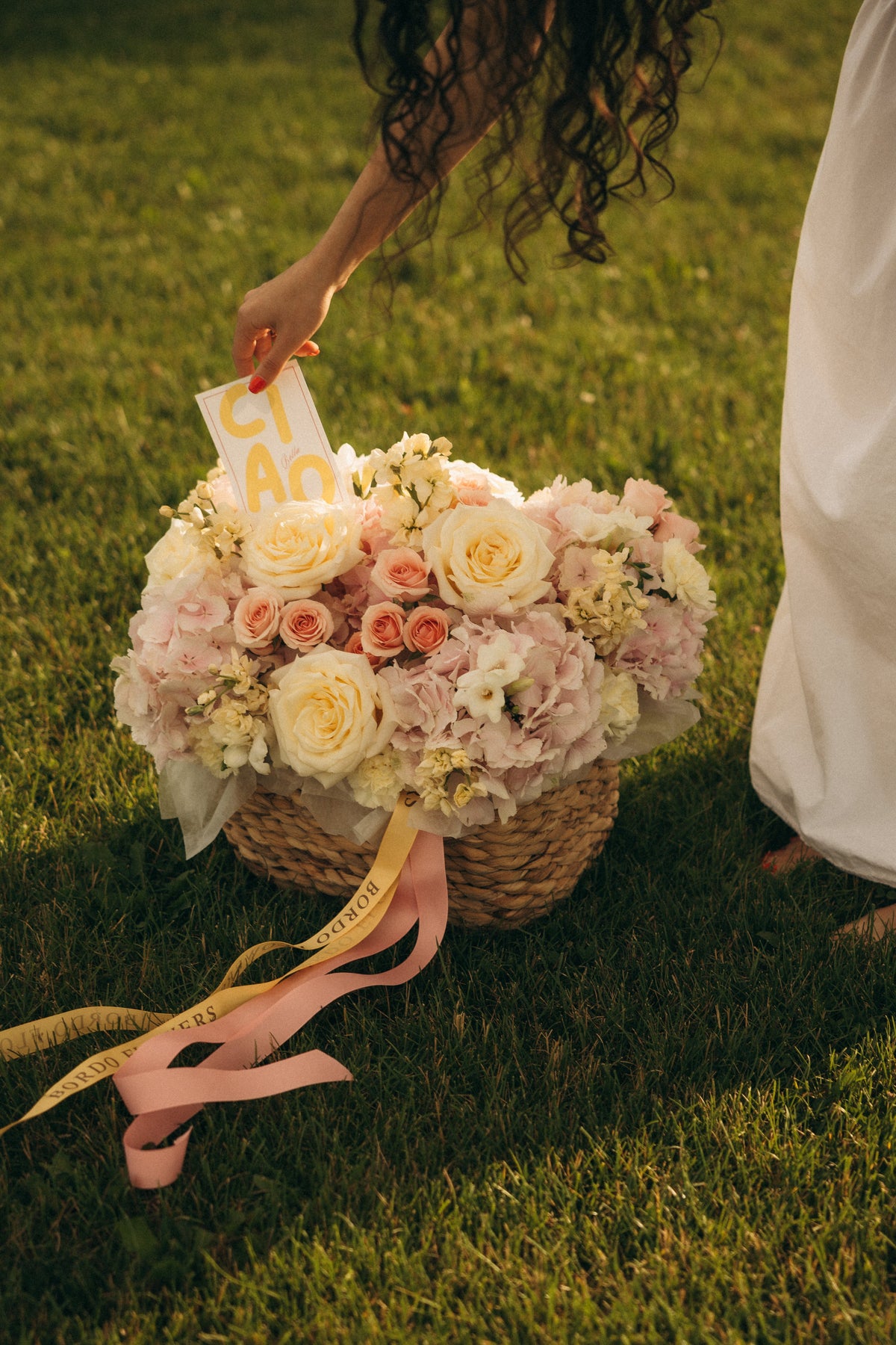 Amore flower basket featuring pink Dutch hydrangeas and pastel roses