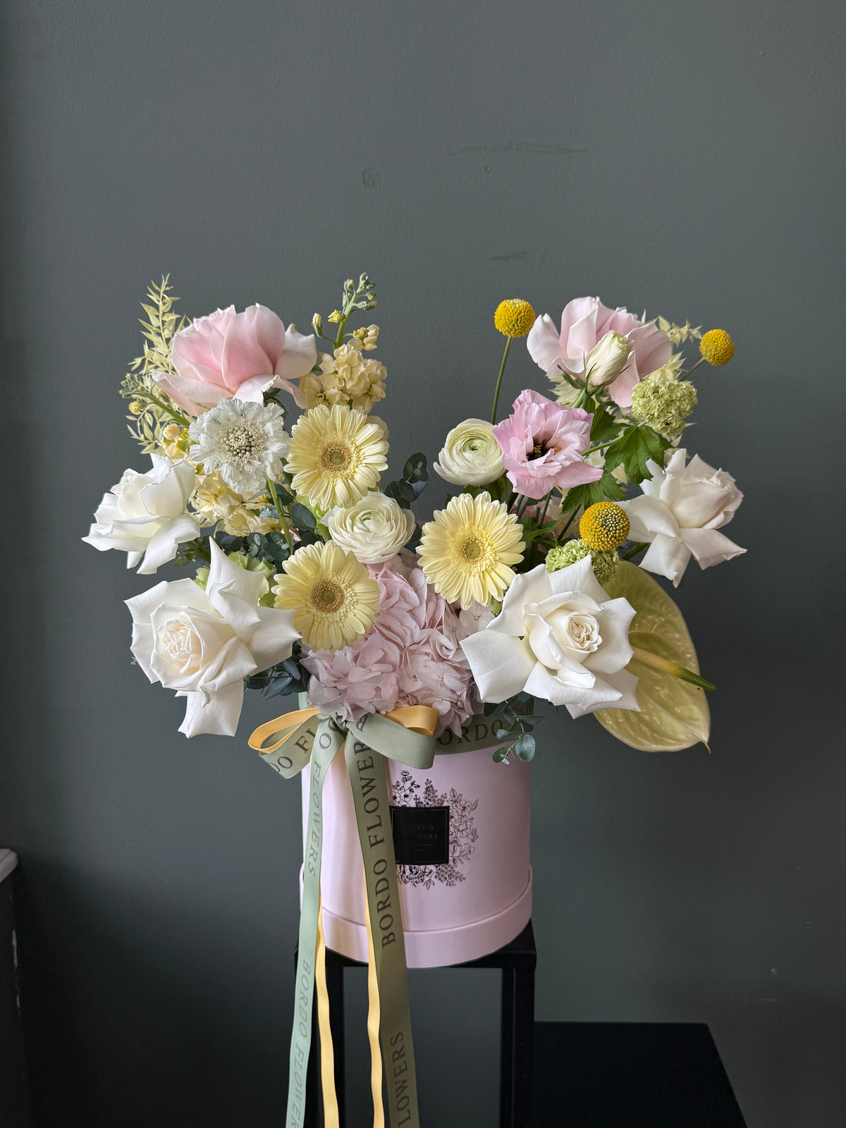 Limoncello flower box featuring yellow gerberas and seasonal flowers