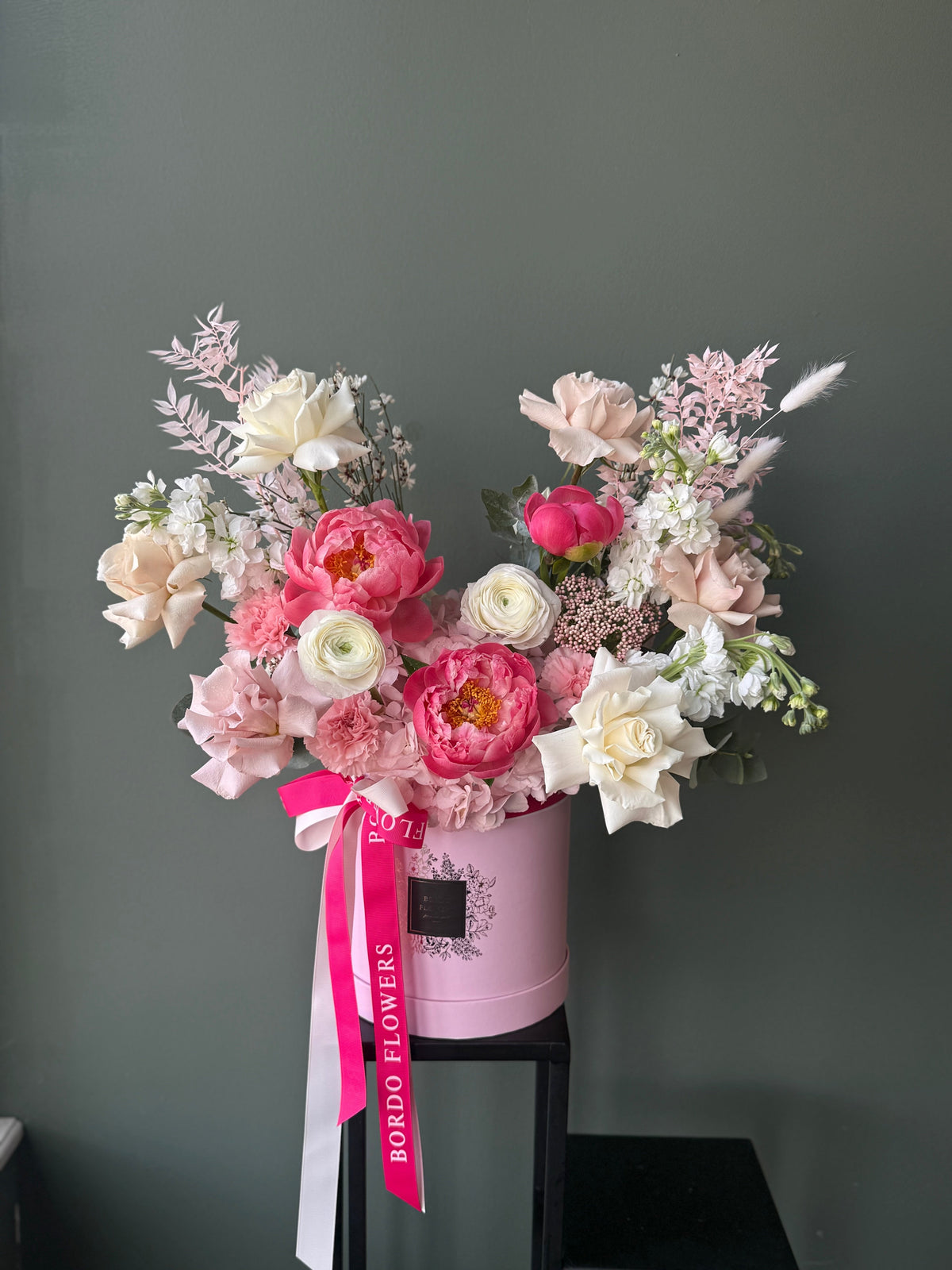 "Raspberry Tart" signature box: blush, white, and raspberry-pink blooms. Includes a wet floral sponge for hydration. Design confirmed before delivery in Dallas TX.