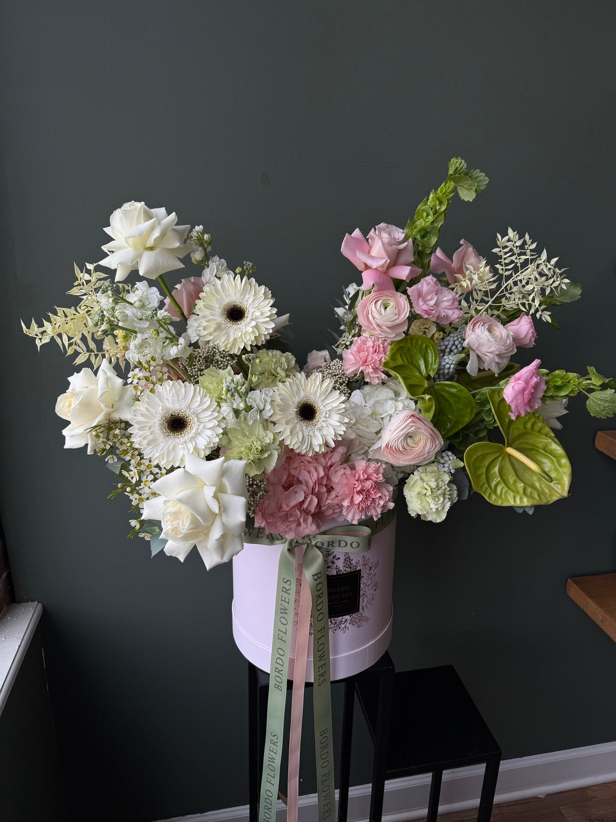 Luxury floral box arrangement with pink, white, and green flowers