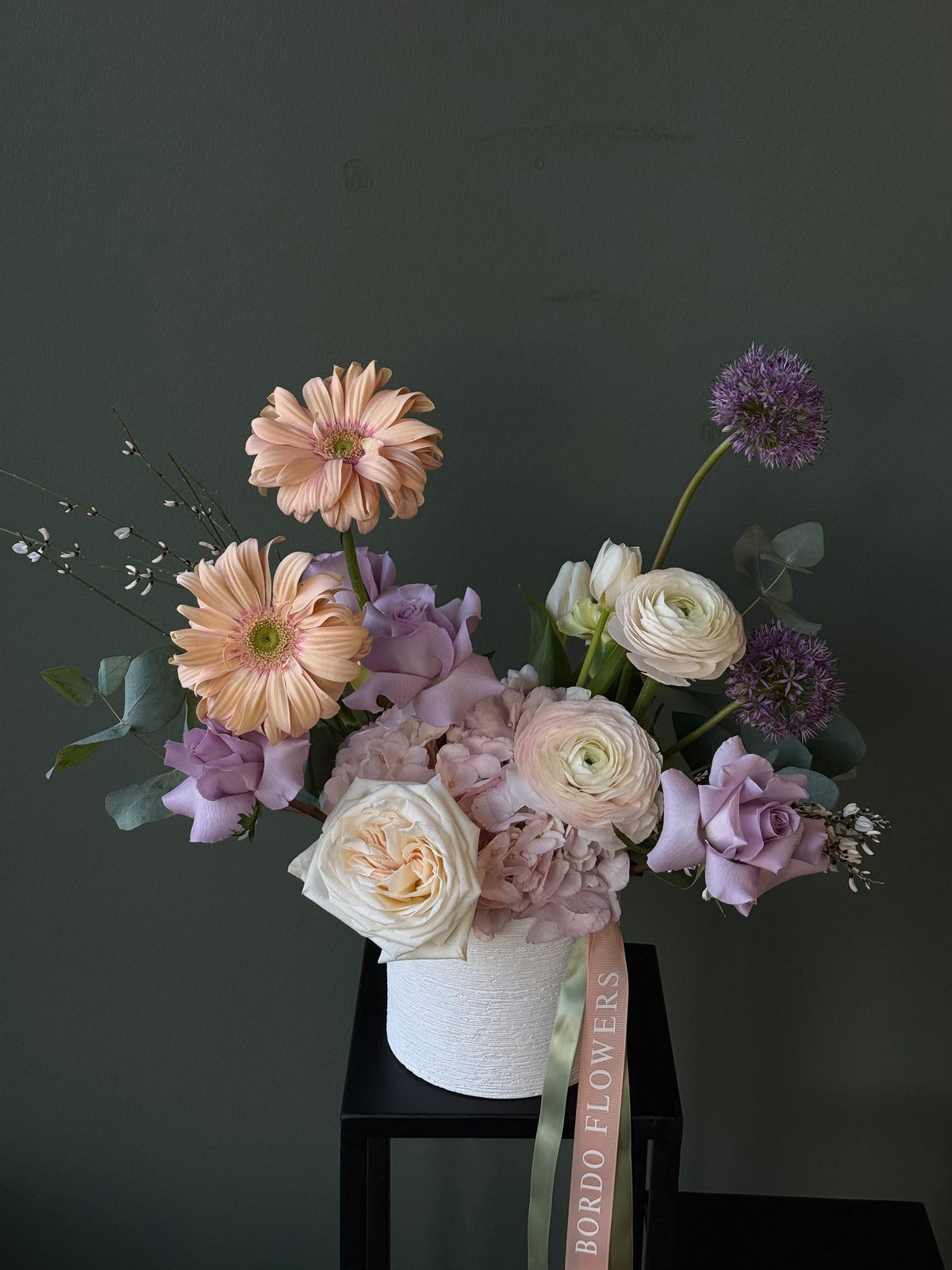 Custom floral arrangement in an elegant vase by Bordo Flowers