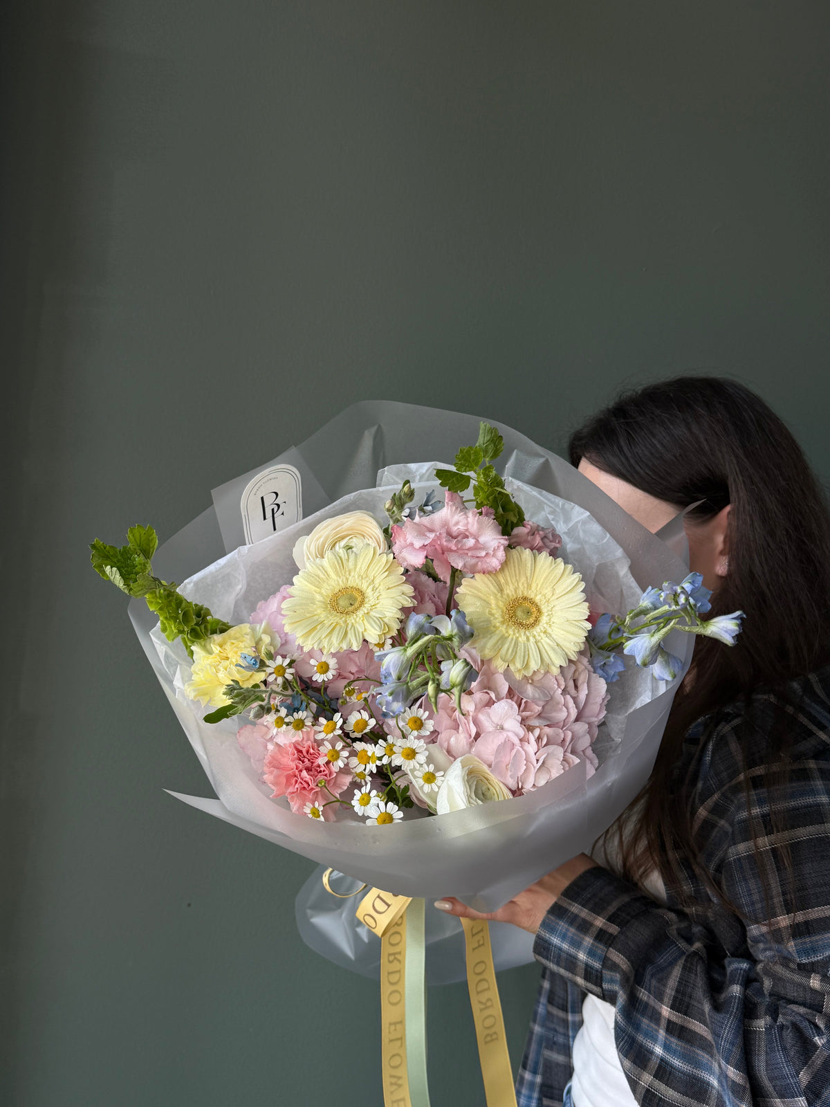 Colorful rounded spring bouquet with premium seasonal flowers
