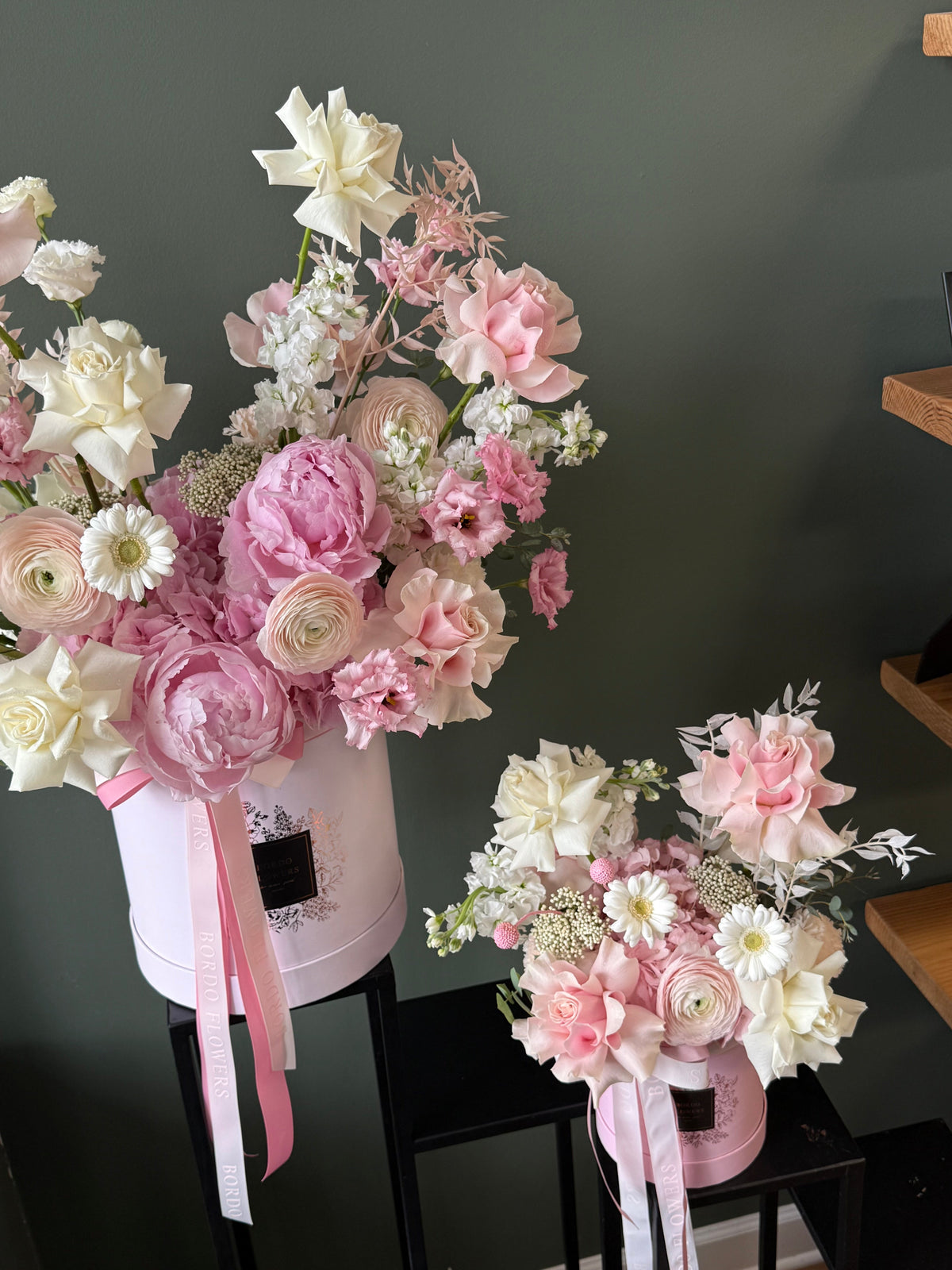 Soft pink and white flower arrangement in an elegant box